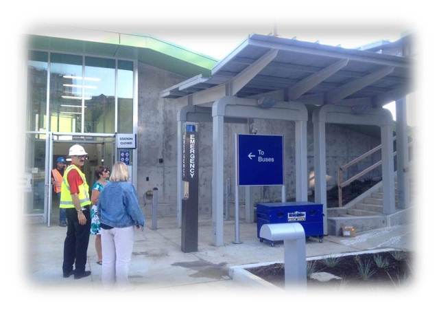 Front Rail Station is pictured along with a close up of the main entrance with Susan Orona, FTA, Mike Shipper, GCRTA Deputy General Manager, Engineering & Project Management, and Tracey Loeber, PMOC.
