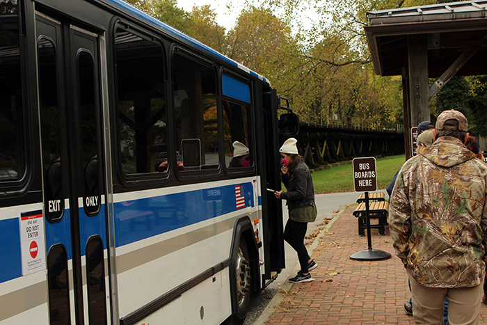 People boarding a metro bus