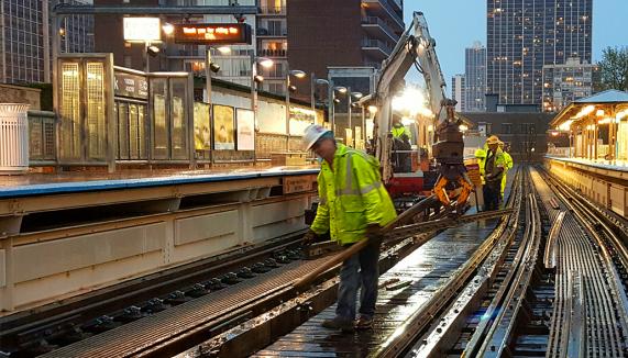 Safety workers working o n a subway line
