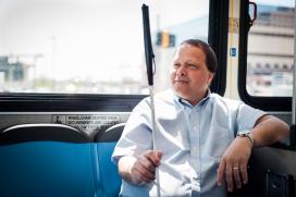 Man with cane on bus