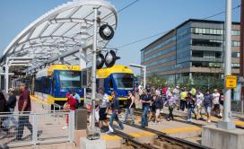 Passengers in front of Metro Transit train