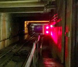 Red stop signal in subway tunnel