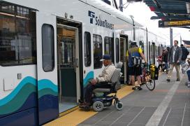 Passengers board Sound Transit light rail