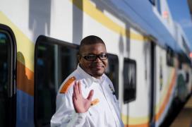 Courtesy SunRail commuter rail SunRail train operator in front of train