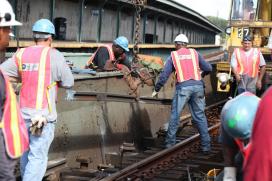 Courtesy MTA Transit workers on the track
